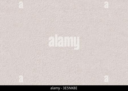 Macro texture uniforme de calcaire crème pâle ou grès. Surface en pierre naturelle finement granulée idéale pour les arrière-plans architecturaux et la décoration intérieure Banque D'Images