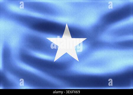 Drapeau de la Somalie agitant au vent, avec une seule étoile blanche centrée sur un fond bleu clair Banque D'Images