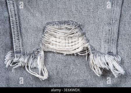 Jean déchiré textile gris. Banque D'Images