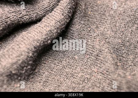 Texture de tissu de laine grise — gros plan macro froissé avec arrière-plans légèrement flou Banque D'Images