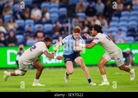 Sydney, Australie. 17 avril 2026. SID Harvey des Waratahs est attaqué lors du match de Super Rugby Pacific Rd 10 2026 entre les Waratahs et Moana Pasifika à l'Allianz Stadium le 17 avril 2023 à Sydney, Australie crédit : IOIO IMAGES/Alamy Live News Banque D'Images