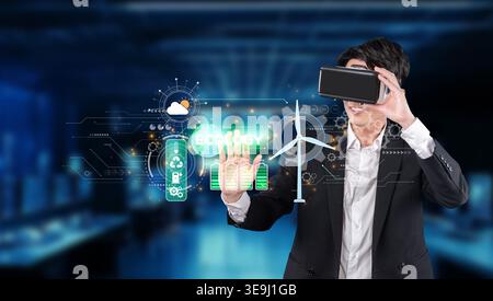 Un professionnel des affaires s'engage avec la réalité virtuelle, présentant des solutions innovantes pour la durabilité, l'énergie propre et la conscience écologique dans un Banque D'Images