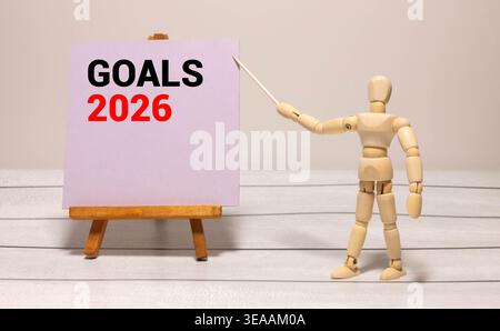 Résolutions du nouvel an 2026 sur la table. liste des objectifs 2026 avec cahier, plante sur fond de bois. Résolutions, plan, objectifs, action, liste de contrôle, conce d'idées Banque D'Images