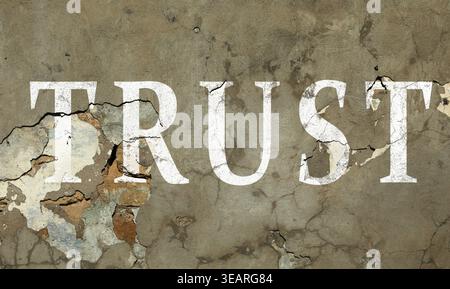 Word Trust et fissures sur le mur. Trahison Banque D'Images