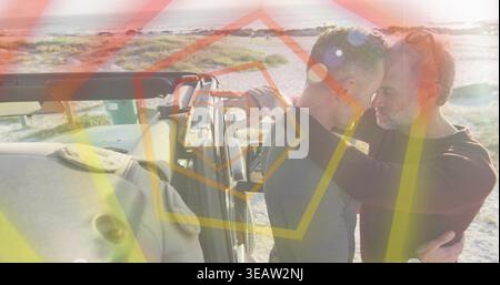Pressant les fronts deux hommes debout près de SUV sur les dunes côtières, portant un tricot foncé et un haut clair Banque D'Images