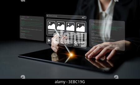 Un utilisateur professionnel s'engage avec une tablette tactile futuriste, explorant une interface numérique pour les tâches créatives et le développement d'applications dans un Banque D'Images