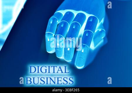 Gros plan d'une main robotique avec le texte « Digital Business », représentant l'entrepreneuriat moderne, l'innovation et les opérations axées sur la technologie. Futur Banque D'Images