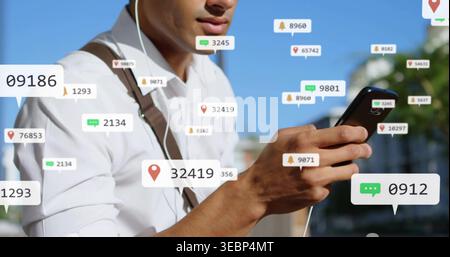 Vérification du téléphone noir, homme en chemise blanche, bretelles brunes sur le trottoir de la ville, écouteur filaire avec alertes Banque D'Images