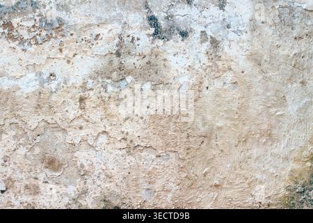 Macro de mur en béton peint rustique fissuré par les intempéries Banque D'Images