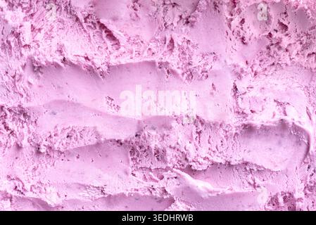 Texture de crème glacée bleuet. Glace rose de baies détaillée ou sorbet comme arrière-plan. Banque D'Images