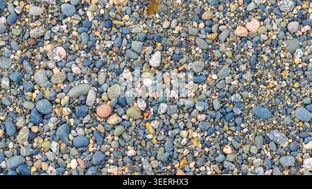 Le motif plein cadre affiche des cailloux, des roches, du sable. Textures lisses montrées à travers une lumière douce. Favorise le calme, la détente, bon pour les arrière-plans et EA Banque D'Images