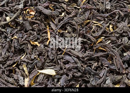 image macro de thé noir en vrac aromatisé aux agrumes et à la citronnelle Banque D'Images