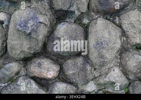 Vue rapprochée d'un mur de pierre fait par l'homme. Banque D'Images
