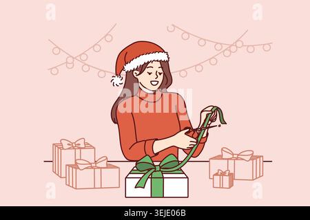 Femme de Noël fait des cadeaux de ses propres mains, se réjouissant à l'approche des vacances du nouvel an Banque D'Images