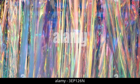 Fond de fête irisé scintillant reflétant les couleurs holographiques de l'arc-en-ciel Banque D'Images