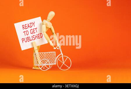 Prêt à obtenir le symbole des mots publiés. Mots conceptuels prêts à être publiés sur un beau livre blanc. Beau fond orange. L'entreprise est prête à l'emploi Banque D'Images