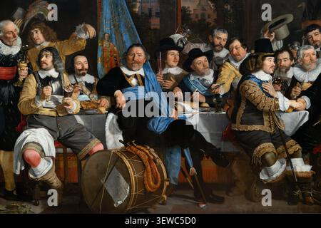 Amsterdam, pays-Bas - 15 avril 25 : Amsterdam, pays-Bas - 15 avril 25 : Crop rapproché d'un portrait de groupe de banquet de l'âge d'or néerlandais, montrant des hommes assis Banque D'Images