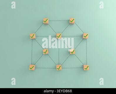 Cubes en bois avec des coches vertes reliées par des lignes pointillées, créant un diagramme de maison. Représenter les choix immobiliers ou la sélection de propriétés Banque D'Images