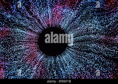 Arrière-plan futuriste abstrait présentant un cercle noir central entouré d'une explosion de particules bleues et violettes lumineuses, ressemblant à une iris numérique Banque D'Images