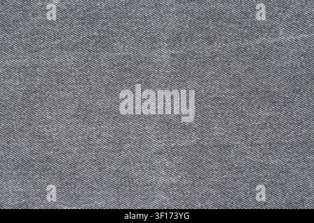 Macro détaillée d'un tissu sergé gris. Textile monochrome avec un motif de tissage diagonal distinct. Fond neutre et texturé pour la mode, les tissus d'ameublement ou Banque D'Images