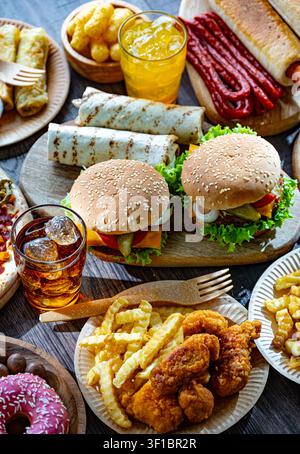Aliments augmentant le risque de cancer. Malbouffe. Banque D'Images
