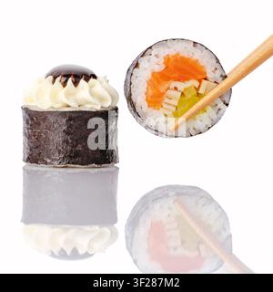 Assortiment de rouleaux de sushi japonais maki avec baguettes Banque D'Images