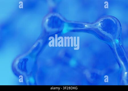 structure moléculaire bleue avec mise au point douce et profondeur de champ peu profonde. Fond abstrait scientifique vitreux pour la médecine, la nanotechnologie et la biochimie Banque D'Images