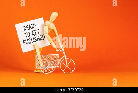 Prêt à obtenir le symbole des mots publiés. Mots conceptuels prêts à être publiés sur un beau livre blanc. Beau fond orange. L'entreprise est prête à l'emploi Banque D'Images