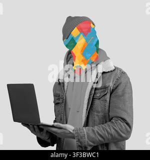 Jeune homme méconnaissable tenant un ordinateur portable devant un fond abstrait coloré, concept d'entreprise Banque D'Images