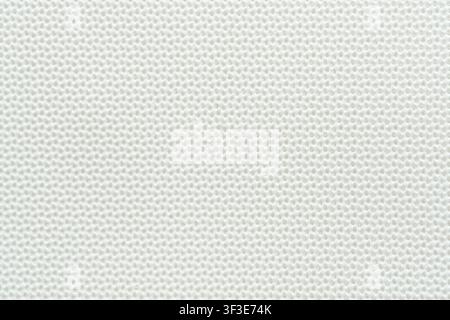 Surface de fond blanc propre et texturée avec un motif subtil de maille fine en gros plan Banque D'Images