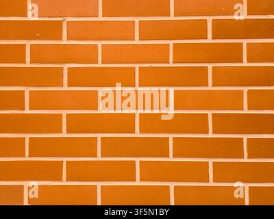 Fond texturé en brique orange propre avec un motif régulier Banque D'Images