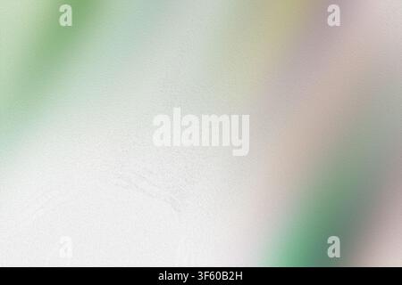 Un fond abstrait texturé avec un dégradé diagonal doux de vert pastel, de blanc et de subtiles touches de rose, évoquant une atmosphère légère et aérée Banque D'Images