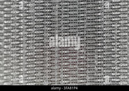Macro rapprochée de la texture d'un tissu tulle blanc en maille avec motif de fil tissé Banque D'Images