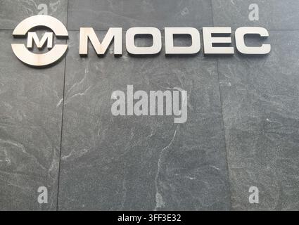 Logo d'entreprise pour MODEC, entrepreneur général et opérateur japonais spécialisé dans les systèmes de production flottants pour l'industrie offshore du pétrole et du gaz Banque D'Images