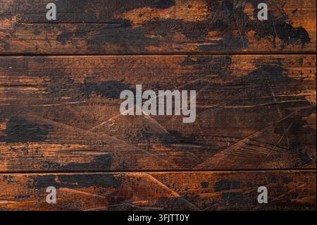 Fond en bois rustique avec texture brûlée sombre parfait pour la photographie de nourriture sombre et les compositions de cuisine confortables Banque D'Images