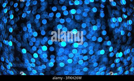 Fond bleu abstrait bokeh avec des lumières floues et lumineuses. Banque D'Images