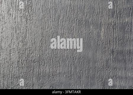 Mur en plâtre texturé gris avec un motif vertical usé et rayé Banque D'Images