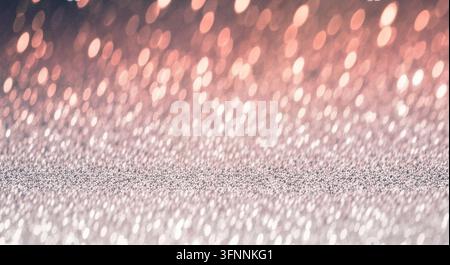 Gros plan d'une texture scintillante avec des effets de lumière bokeh doux. Banque D'Images