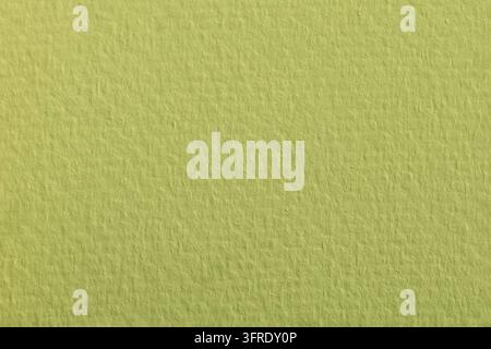 Texture macro d'une surface en papier vert. Fond en carton couleur vert herbe aquarellé Banque D'Images