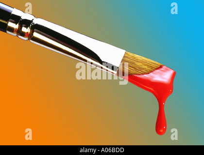 La peinture rouge des gouttes d'un pinceau Banque D'Images