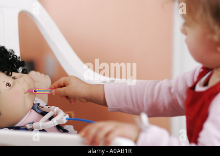 Little girl playing doctor Banque D'Images