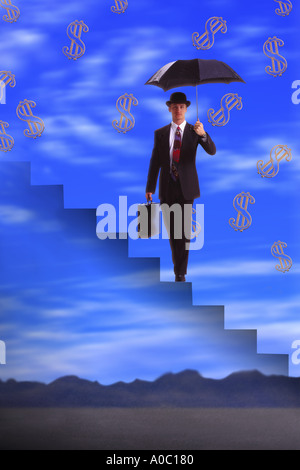 Businessman standing avec de l'argent tomber Banque D'Images