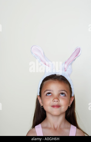 Girl wearing rabbit ears Banque D'Images