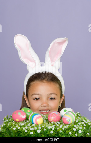 Girl wearing rabbit ears Banque D'Images