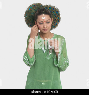 Close-up of a young woman wearing earrings Banque D'Images