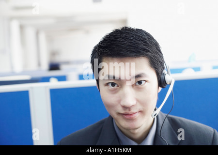 Portrait of a businessman wearing a headset Banque D'Images