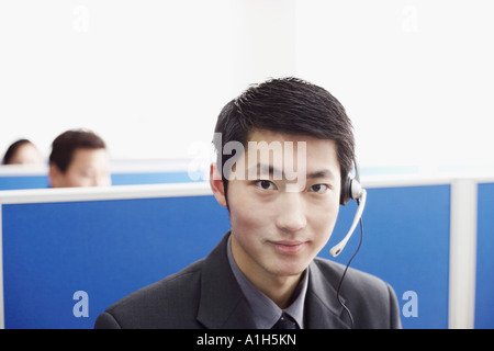 Portrait of a businessman wearing a headset Banque D'Images