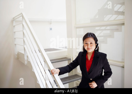 Portrait of a female customer service representative wearing a headset Banque D'Images