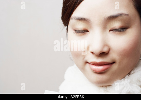 Close-up of a young woman with her eyes closed Banque D'Images