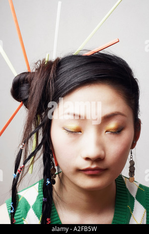 Close-up of a young woman with her eyes closed Banque D'Images